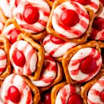 closeup of a bowl of christmas candies with hershey kisses and pretzels