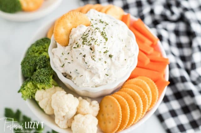 red wine vinegar cream cheese dip with veggies and crackers