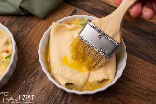 brushing egg wash on a souffle