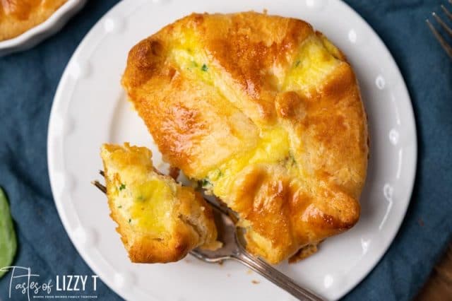 overhead view of an egg souffle on a plate with a fork