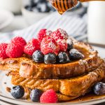 honey dripping over a stack of french toast