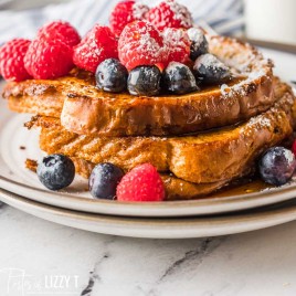 stack of french toast with fresh berries