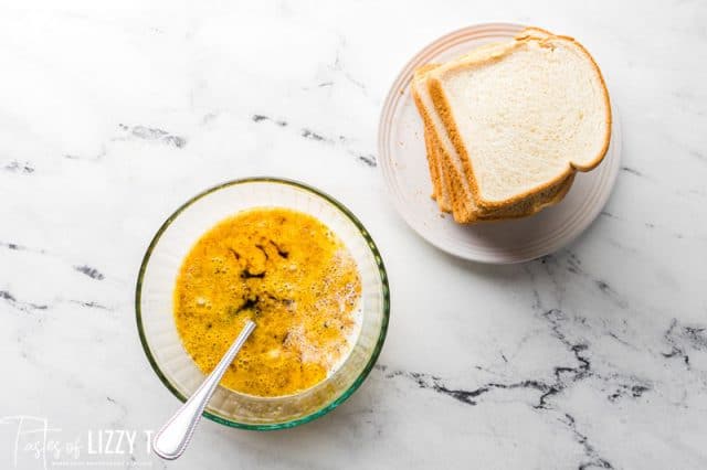egg mixture in a bowl and slices of bread
