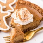 closeup of a piece of pie on a plate with a bite on a fork