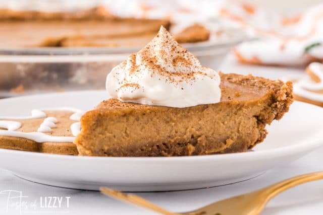 piece of pie on a plate with whipped cream