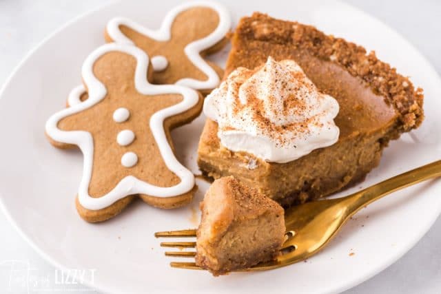 piece of pie on a plate with a fork and gingerbread