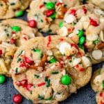 a pile of christmas cookies with M&Ms