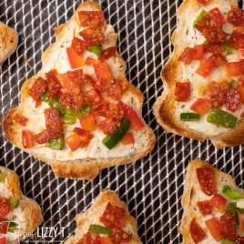 christmas tree pizzas on a baking screen