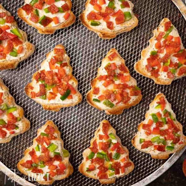 christmas tree pizzas on a baking screen