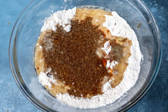 molasses poured over flour in mixing bowl