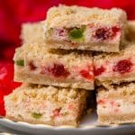 stack of merry cherry cheesecake bars on a plate