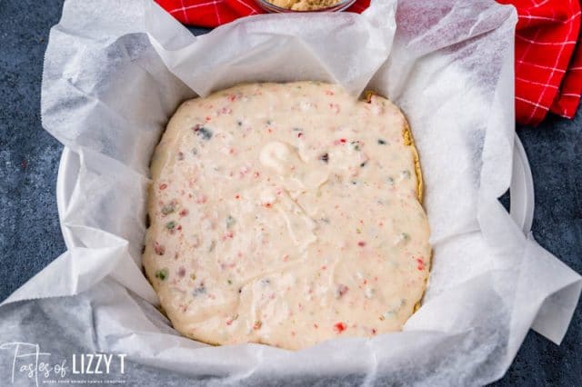 unbaked cheesecake bars in a pan