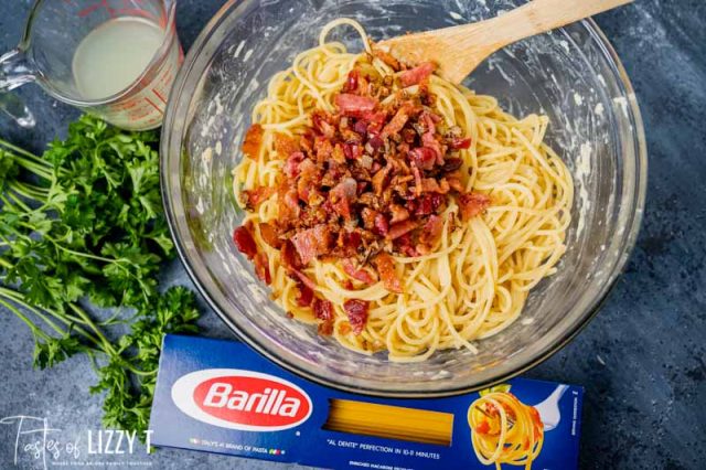 bacon over pasta in a bowl