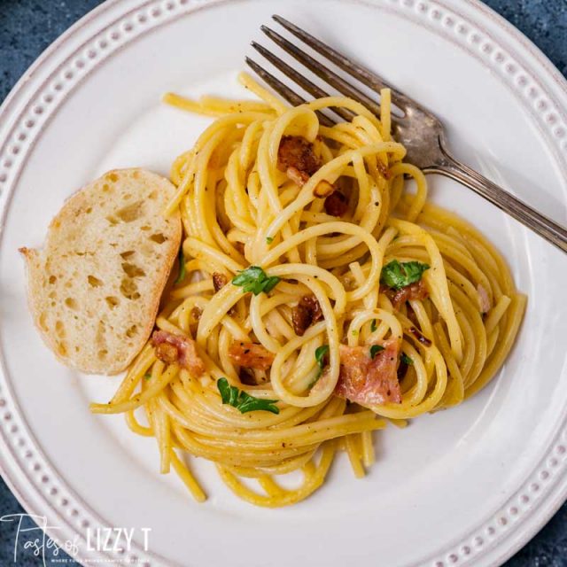 pasta carbonara on a plate with bread