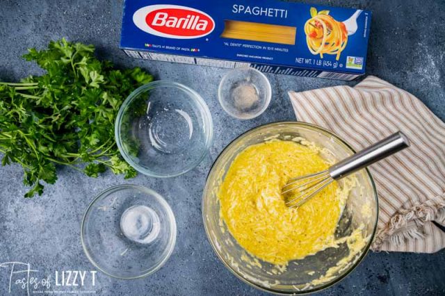 ingredients for carbonara with mixed eggs in a bowl