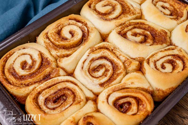 baked sourdough cinnamon rolls in a pan