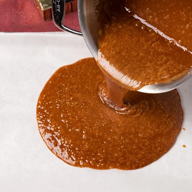 toffee pouring on parchment paper