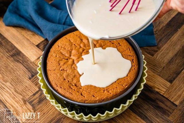 milk pouring over cake in a pan