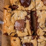 spatula pulling a gooey congo bar out of the pan