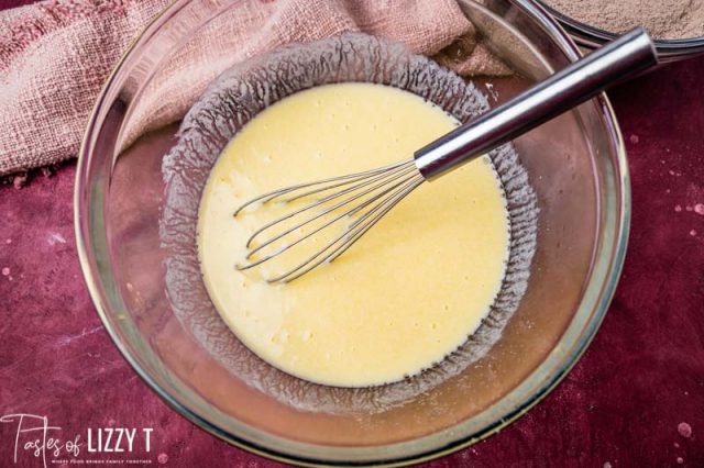 egg mixture in a mixing bowl with a whisk