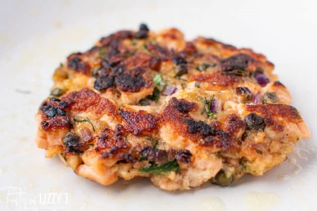 fried salmon patty in a skillet