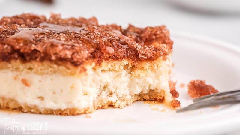 cheesecake bar on a plate with one bite missing