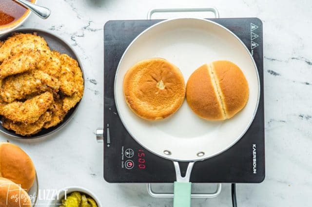 bun heating in a skillet