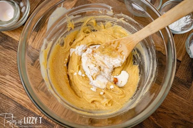 cream in cookie dough in a mixing bowl