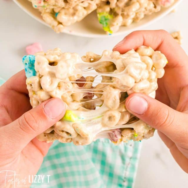 hand pulling marshmallow treat