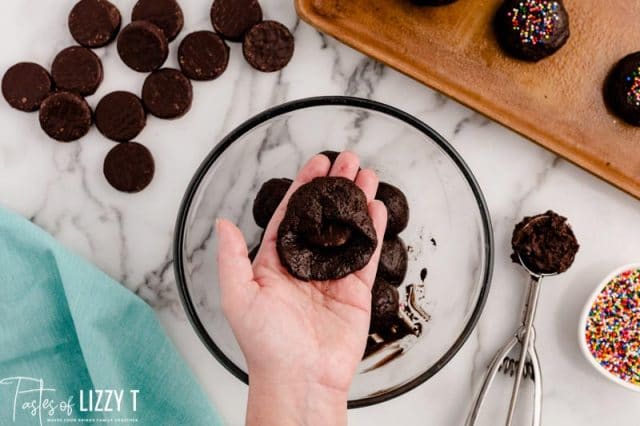 shaping cookie dough around a peppermint patty