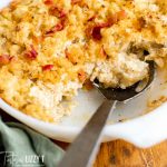 potatoes romanoff in a pan with a spoon