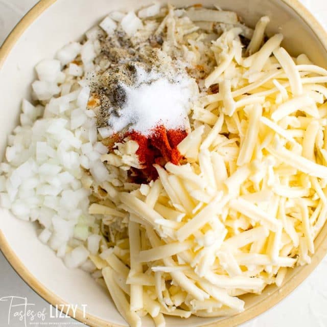 unmixed hashbrowns and cheese in a bowl