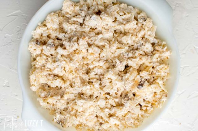 unbaked potatoes romanoff in a baking dish