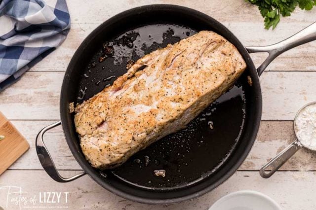 browning pork loin in a skillet