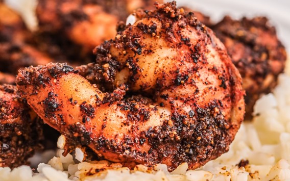 plate with blackened shrimp and rice