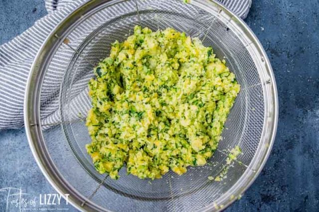 zucchini draining in a colander