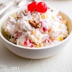 bowl of ambrosia salad with cherries and coconut