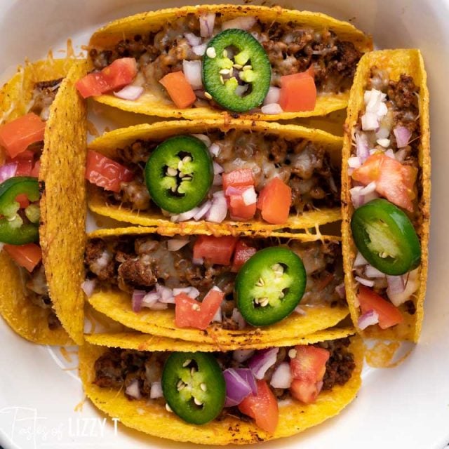 6 hard shell tacos in a pan