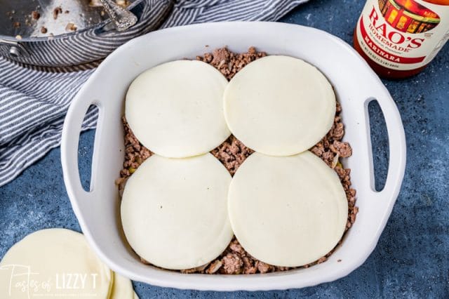 beef and cheese slices in a baking pan