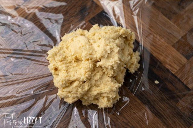 sugar cookie dough on a piece of plastic wrap