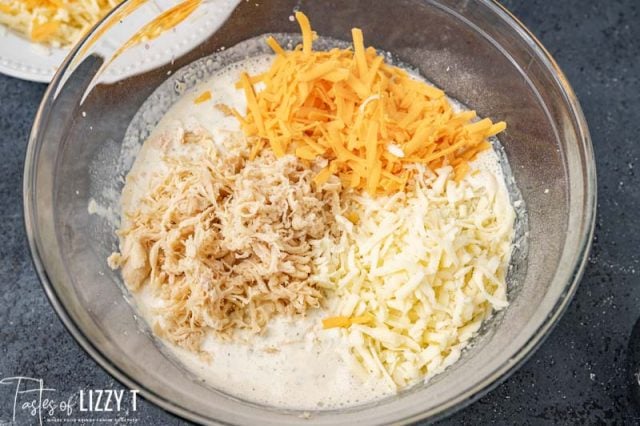 chicken and cheese in a mixing bowl
