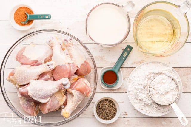 ingredients for fried chicken drumsticks on a table