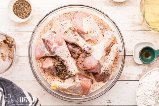 chicken drumsticks soaking in buttermilk