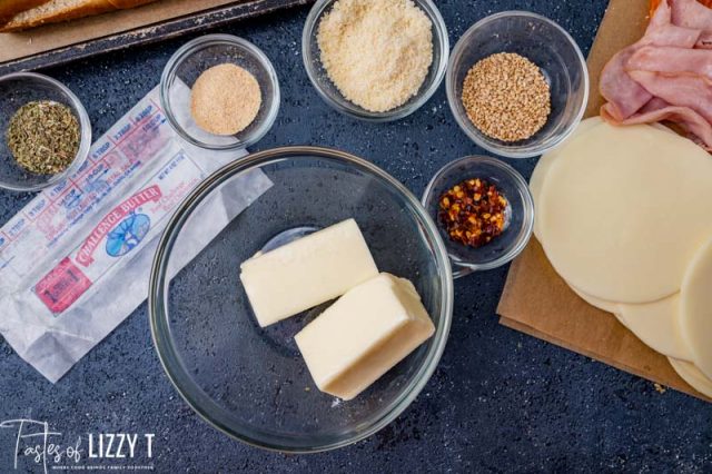 stick of butter cut in half in a mixing bowl