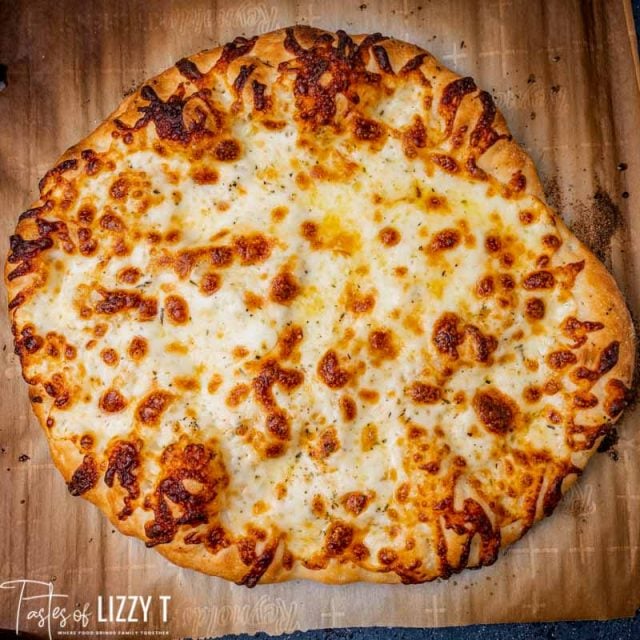 overhead shot of cheesy pizza