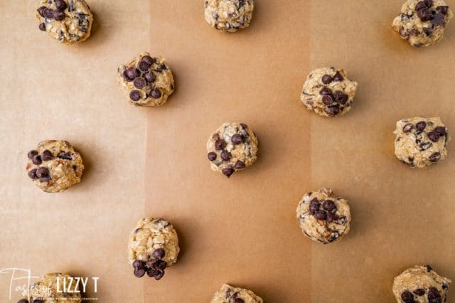 cookie dough balls on parchment paper