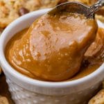 a small bowl of caramel with a spoon