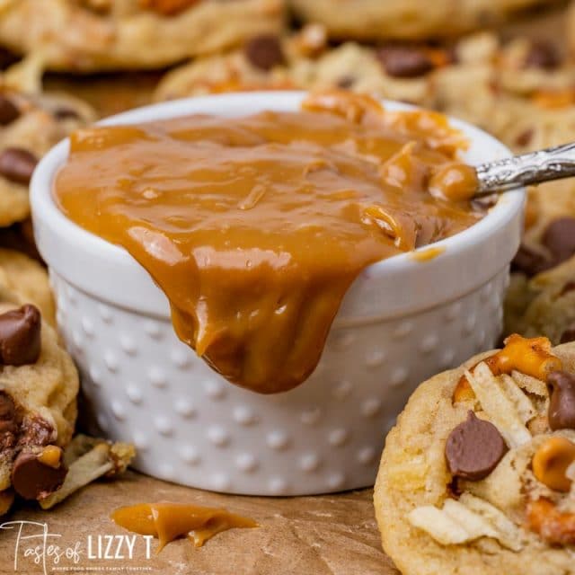 dulce de leche dripping off a white bowl