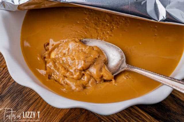 a plate full of dulce de leche with a spoon