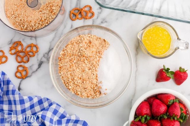 pretzels and sugar in a mixing bowl